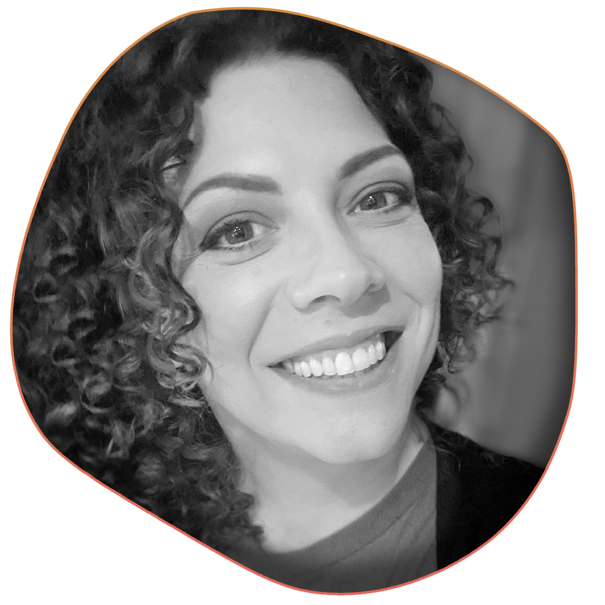 A black and white headshot of the designer, a smiling woman.